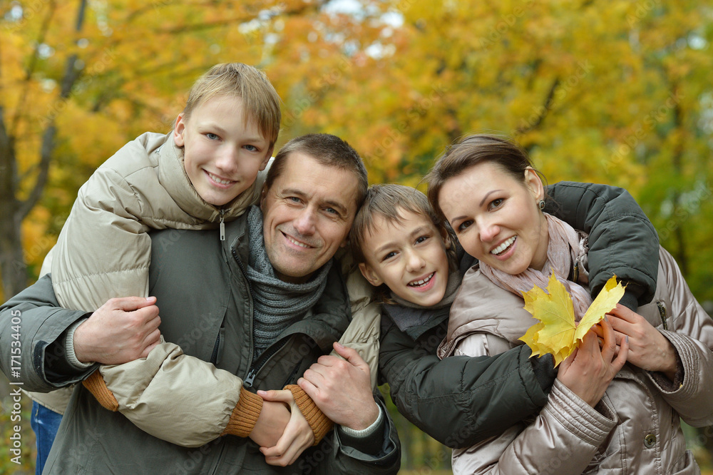 Happy family in autumn forest Happy family in autumn forest
