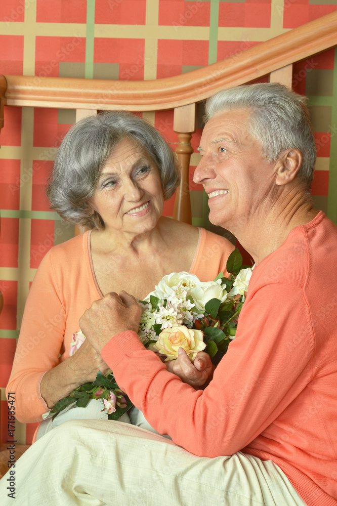 mature couple with bouquet of flowers mature couple with bouquet of flowers