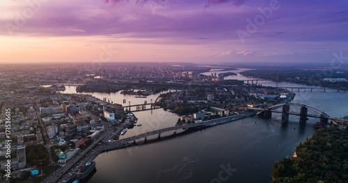 Panoramic view of a modern city with a river, unfinished bridge and park part of the city © LALSSTOCK