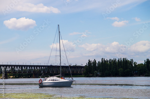 White sailing yacht on the river Dnieper