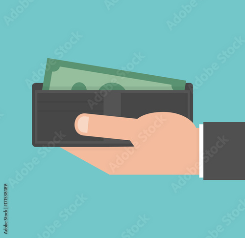 Hand holding wallet with money bill