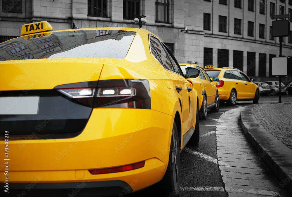 Rear view of yellow taxi on street