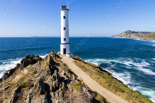 Lighthouse at Cabo Home, an iconic cape in Cangas, Pontevedra, Galicia, Spain photo