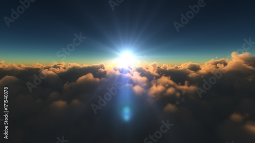 sunrise above in clouds