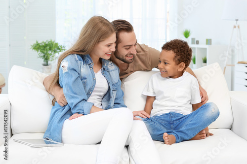 Happy couple with adopted A...
