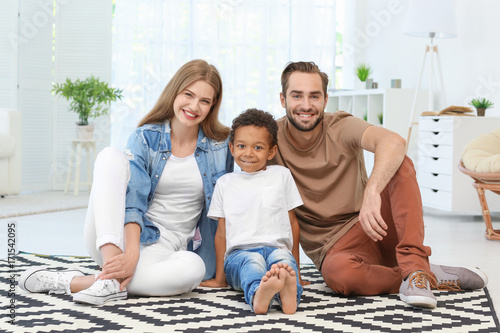 Happy couple with adopted A...