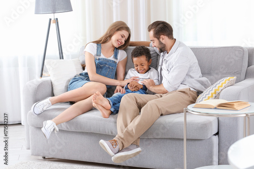 Happy couple with adopted A...