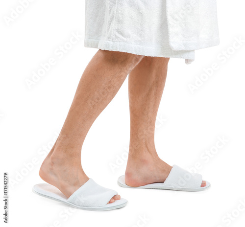 Man in bathing slippers on white background