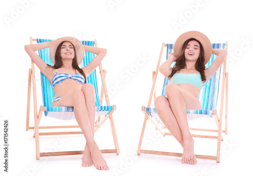 Beautiful young women sitti...