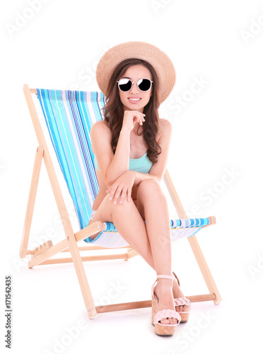Beautiful young woman sitti...