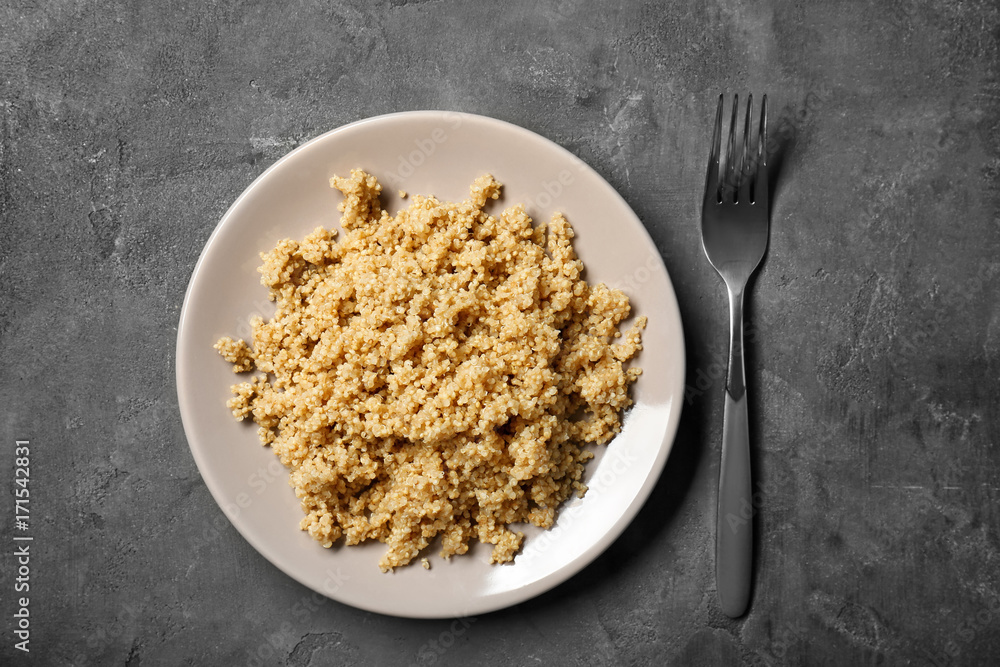 Cooked quinoa on grey background Cooked quinoa on grey background