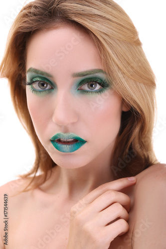 Young woman with bright gre...