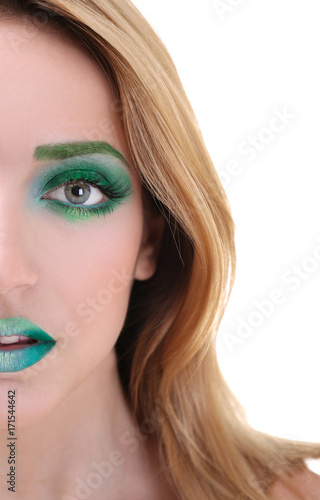 Young woman with bright gre...