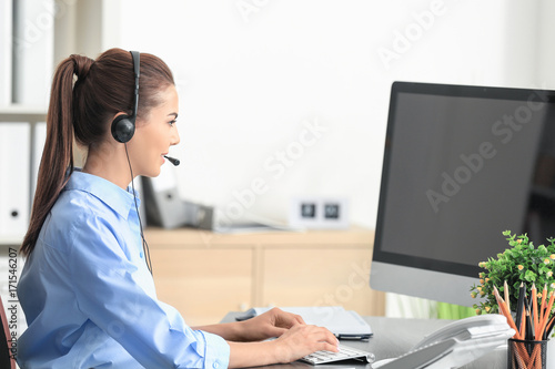 Young female receptionist i...