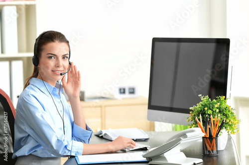 Young female receptionist i...