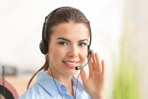 Young female receptionist i...