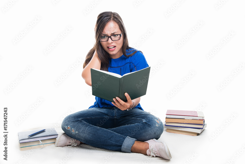 Beautiful student girl sitting looking scared on notebook Beautiful student girl sitting looking scared on notebook