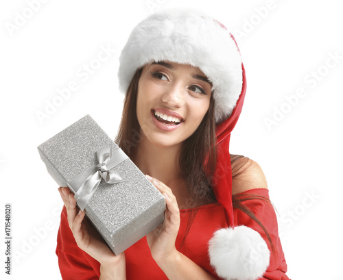Young woman in Santa hat wi...