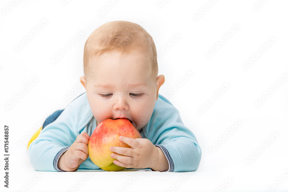 kid with an apple on a white background kid with an apple on a white background