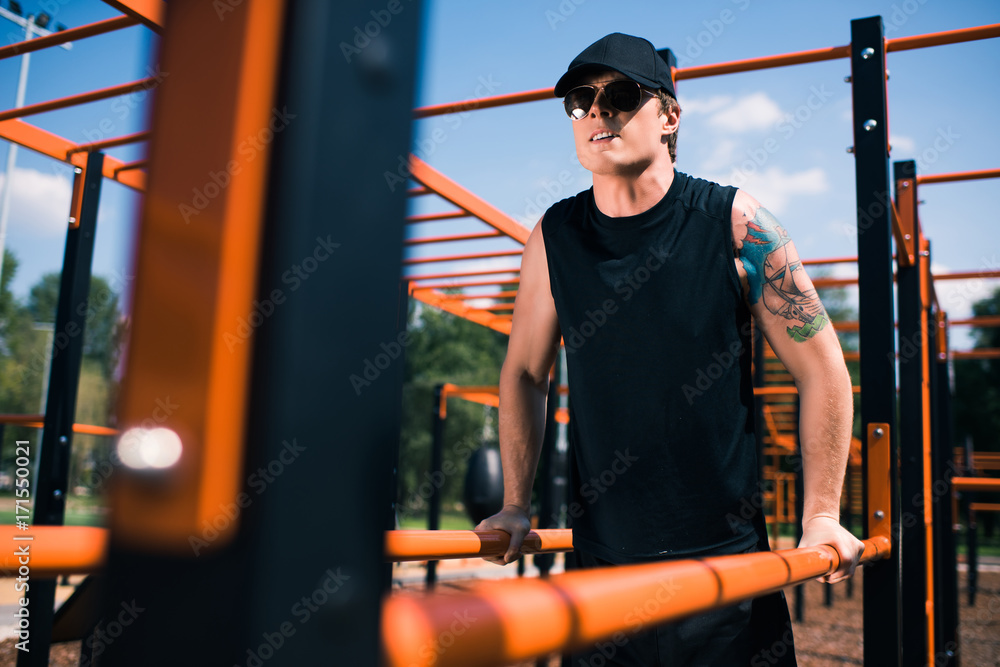 man exercising on sports ground