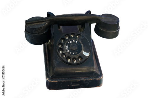 Old vintage black telephone isolated on white background