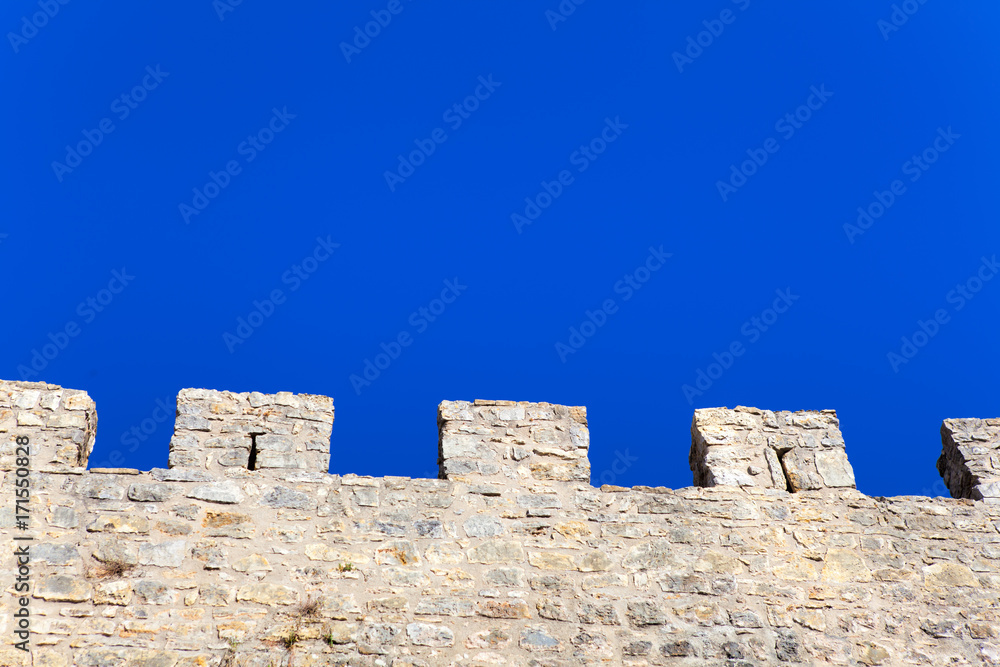 Stone wall and blue sky , background
