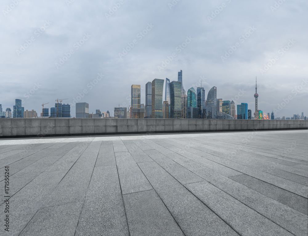 cityscape and skyline of shanghai from empty brick floor.