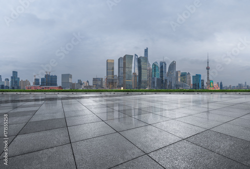 cityscape and skyline of shanghai from empty brick floor.