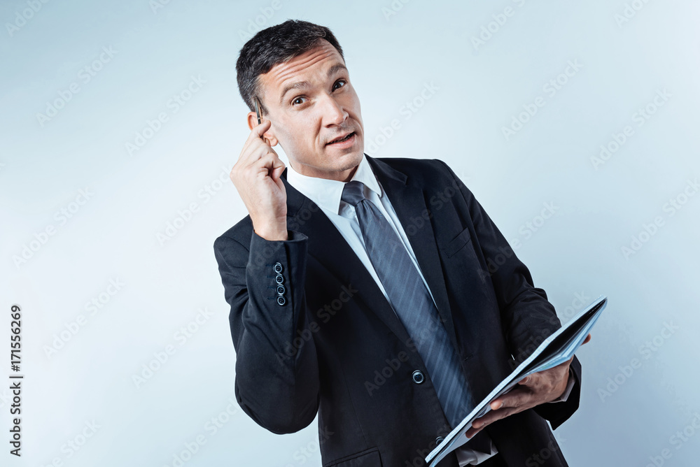 Pensive mature businessman thinking about future project