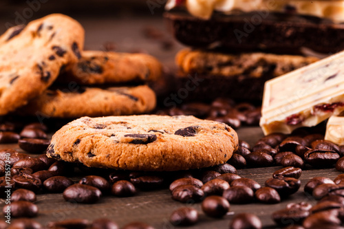 Chocolate cookies, dark and white chocolate on coffee beans