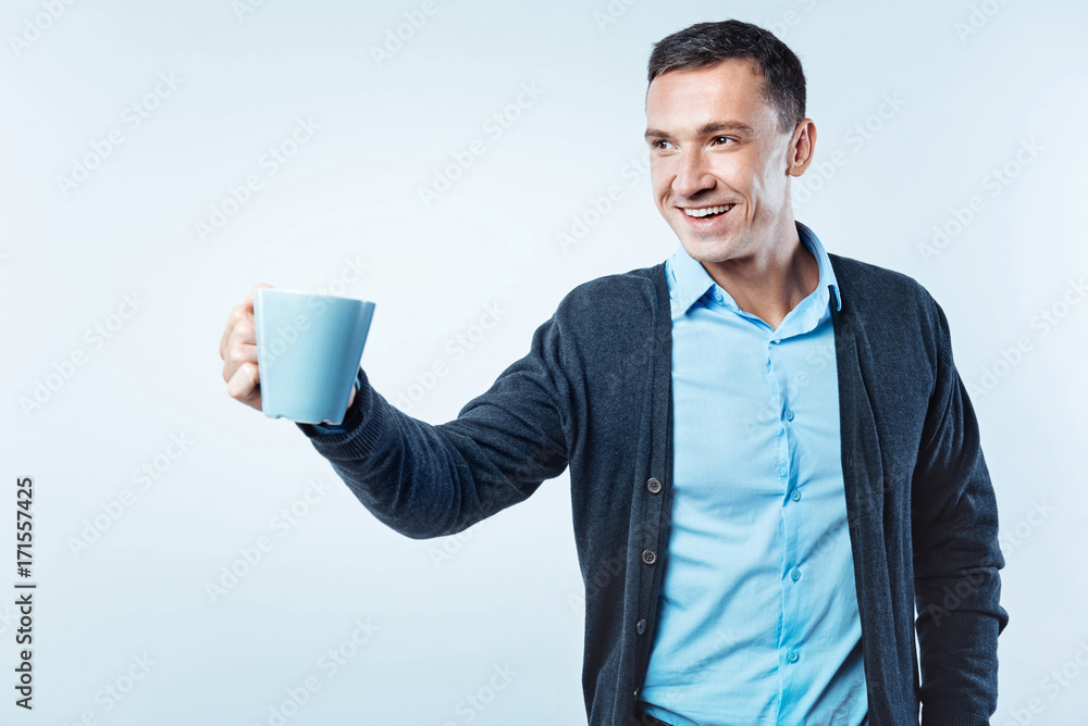 Friendly gentleman proposing cup of coffee Friendly gentleman proposing cup of coffee