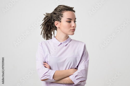 Obraz na plátně Half-length portrait of beautiful woman wearing white blouse looking aside