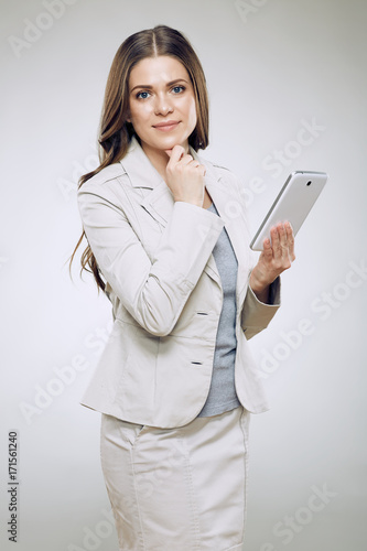 Business woman suit wearinf using tablet for work. photo