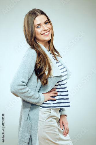 Casual style dressed young smiling woman