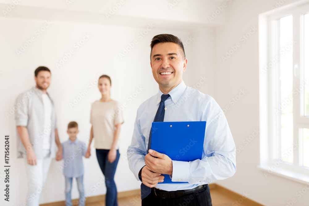realtor with clipboard and family at new home realtor with clipboard and family at new home