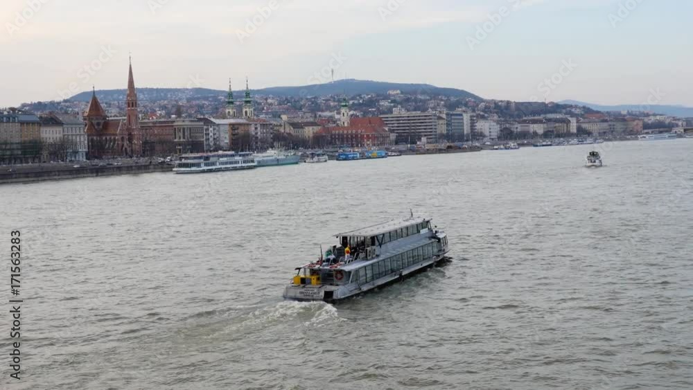 Scenic aerial view of tourist ferry boat and coastal cityscape on background. Sightseeing concept Scenic aerial view of tourist ferry boat and coastal cityscape on background. Sightseeing concept