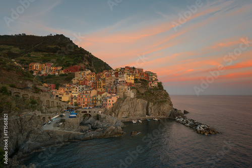 Magnificent sunset view of the Manarola village. Manarola is one of the five famous villages in Cinque Terre (Five lands) National Park. Liguria, Italy, Europe
