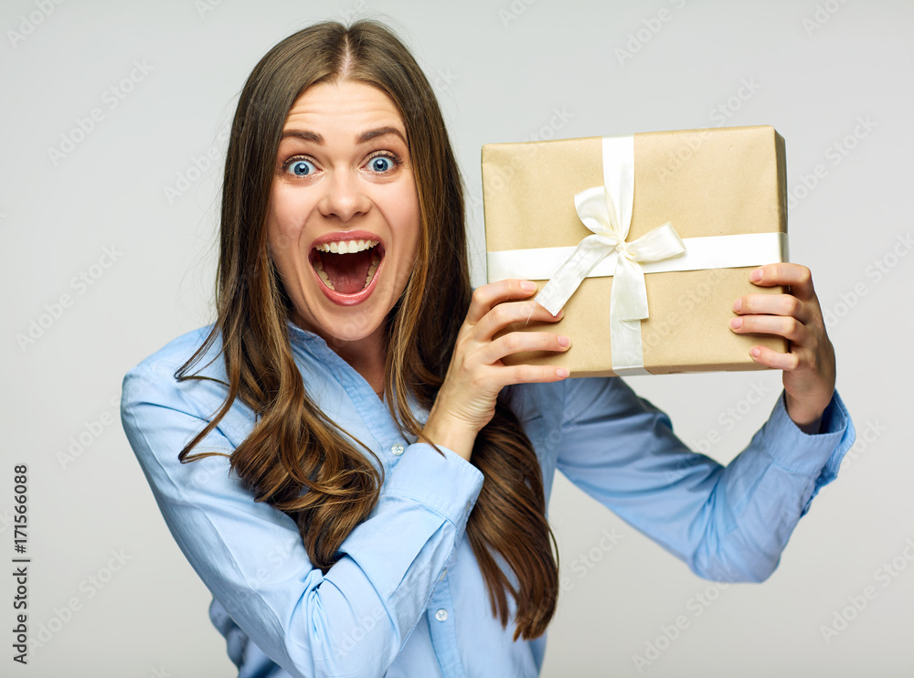 Happy business woman holding gift box. Happy business woman holding gift box.