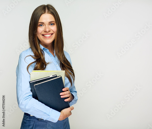 Smiling woman student, teacher or business lady holding books.