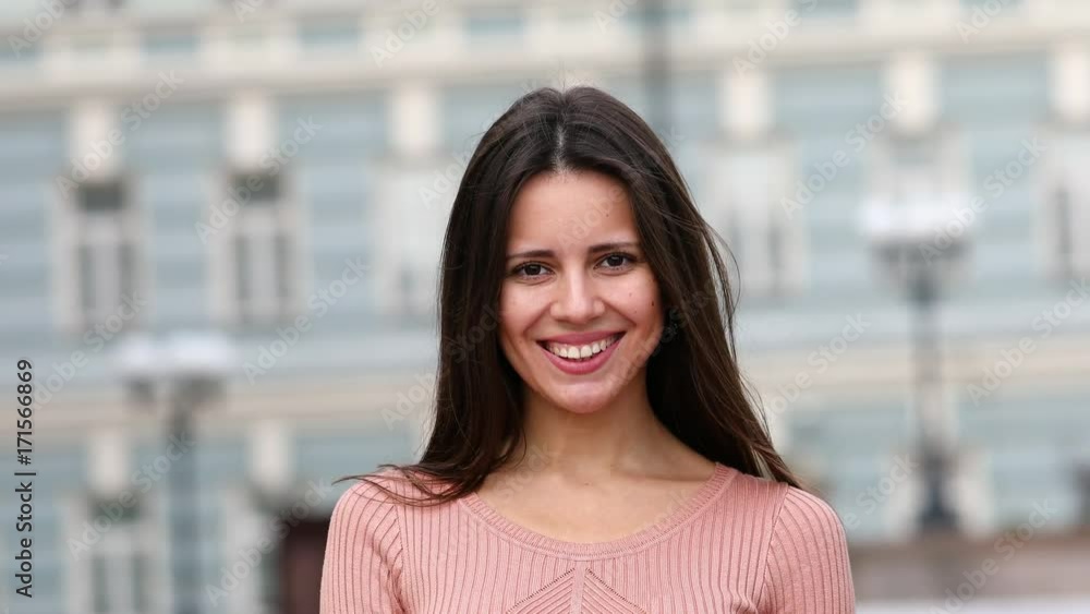 Air kiss. Young brunette woman