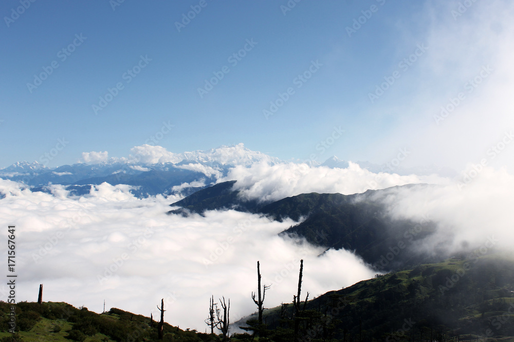 Beautiful landscape of Himalayan ranges covered with white clouds, Sandakphu, West Bengal India