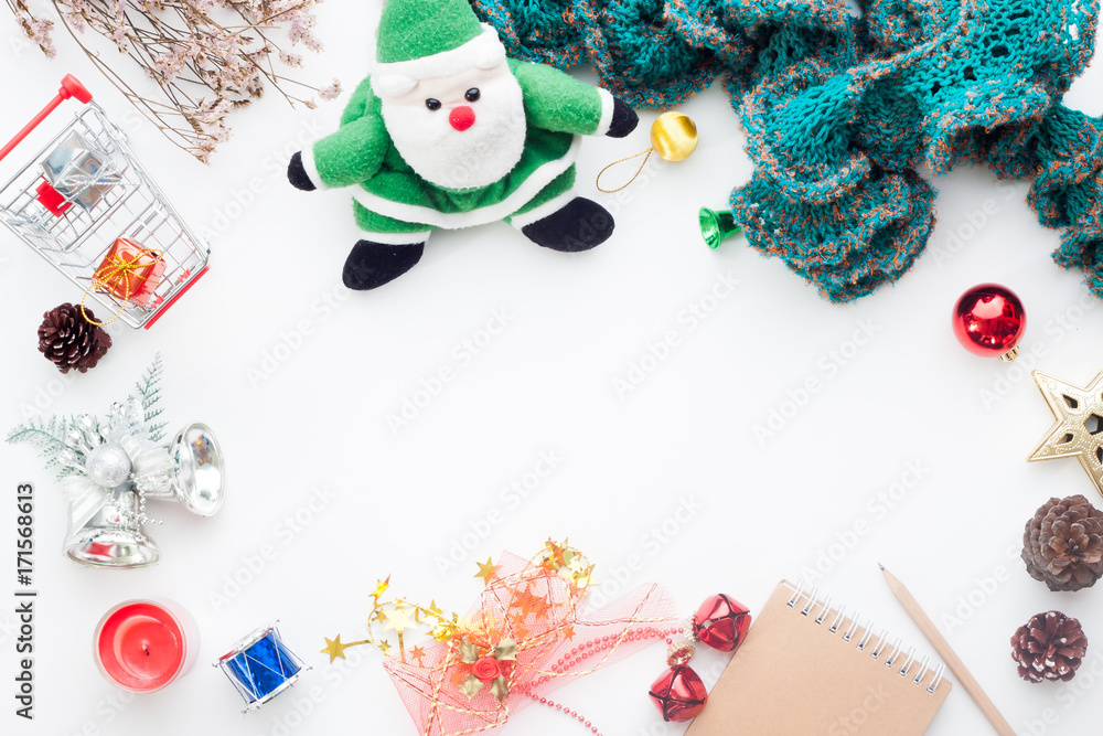 Fototapeta premium Overhead view of Christmas decorations, gift boxes and shopping cart on white background