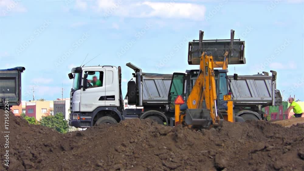 Truck and Excavator with back hoe loading soil, time lapse speed 40x Truck and Excavator with back hoe loading soil, time lapse speed 40x