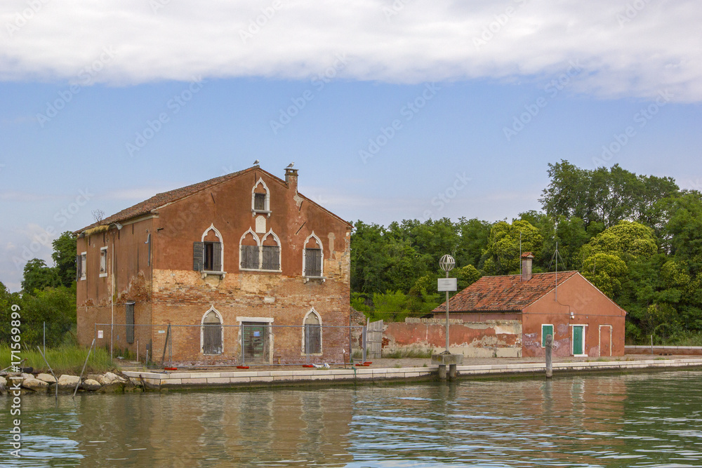 Old houses on the river bank, reflection. Old houses on the river bank, reflection.