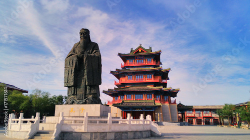  the giant  statue of Confucius and ancient chinese pavilion in the ancient capital  Kaifeng, China photo