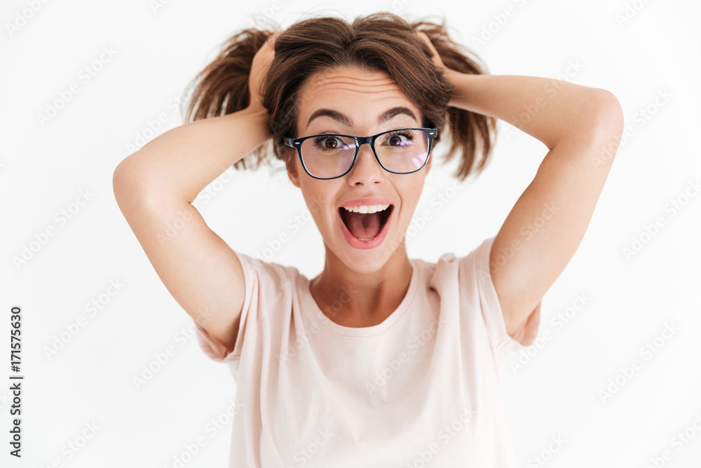 Happy screaming woman in eyeglasses lokking at the camera Happy screaming woman in eyeglasses lokking at the camera
