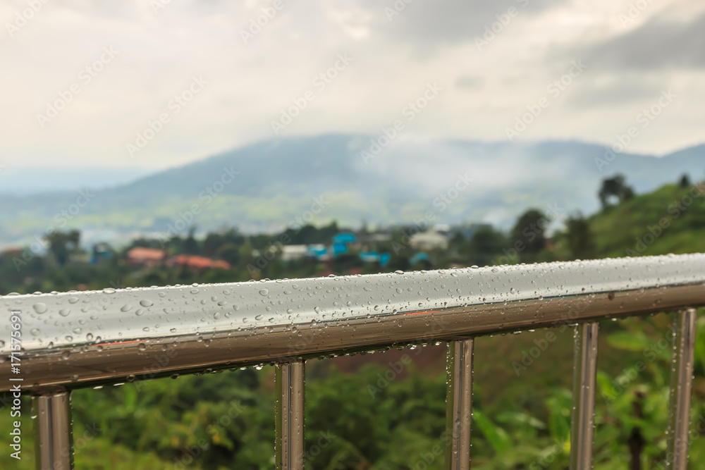 Rain drops on balcony metal balustrade