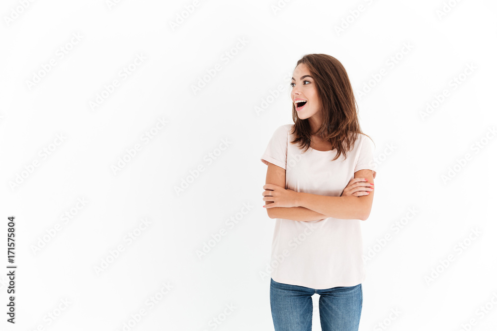 Surprised happy woman with crossed arms looking away Surprised happy woman with crossed arms looking away