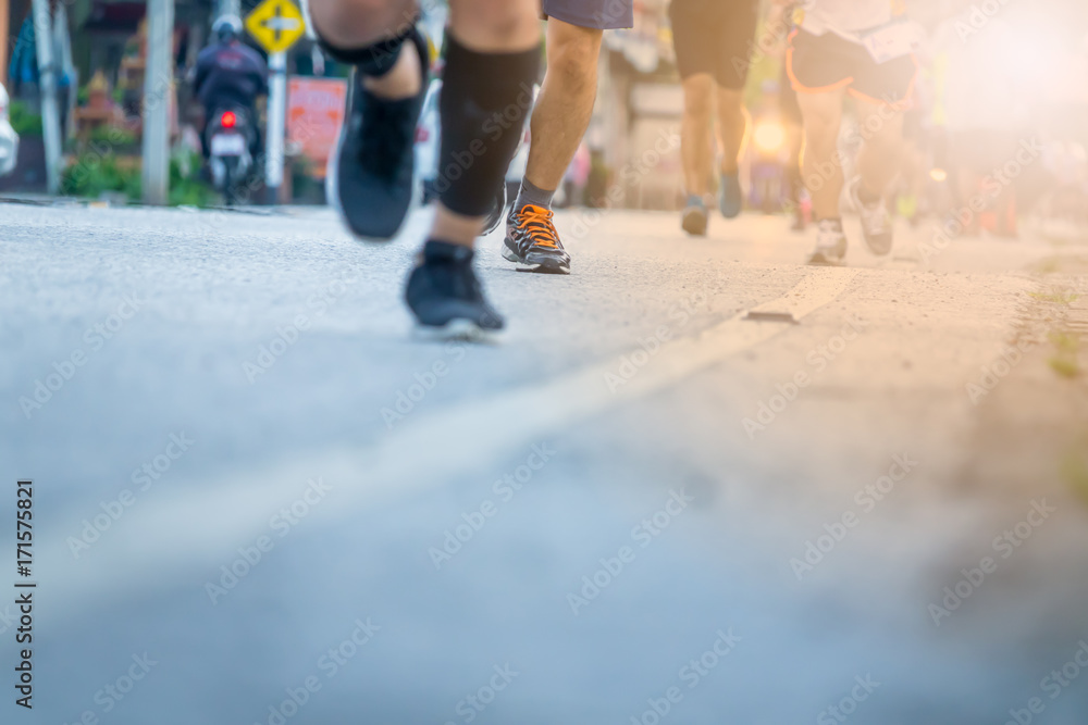 Legs of people on marathon running. Run for health.