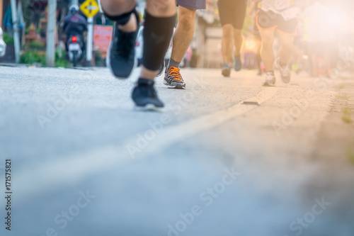 Legs of people on marathon running. Run for health.